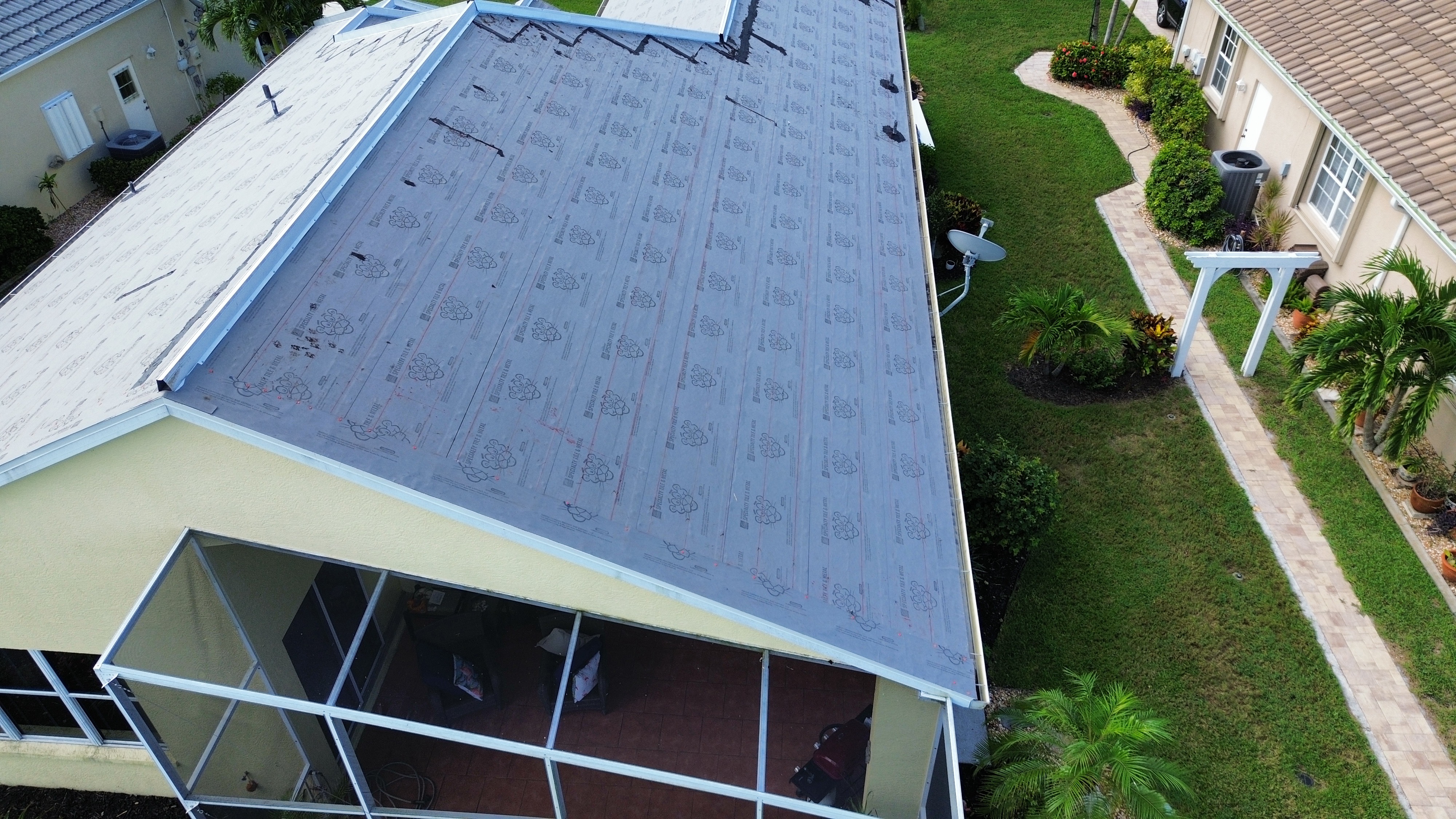 Polyglass PolyAnchor HV flat roof adjacent to terracotta tile SWFL